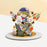 Grey buttercream frosting cake, with 2d printed rockets and astronaut figurines