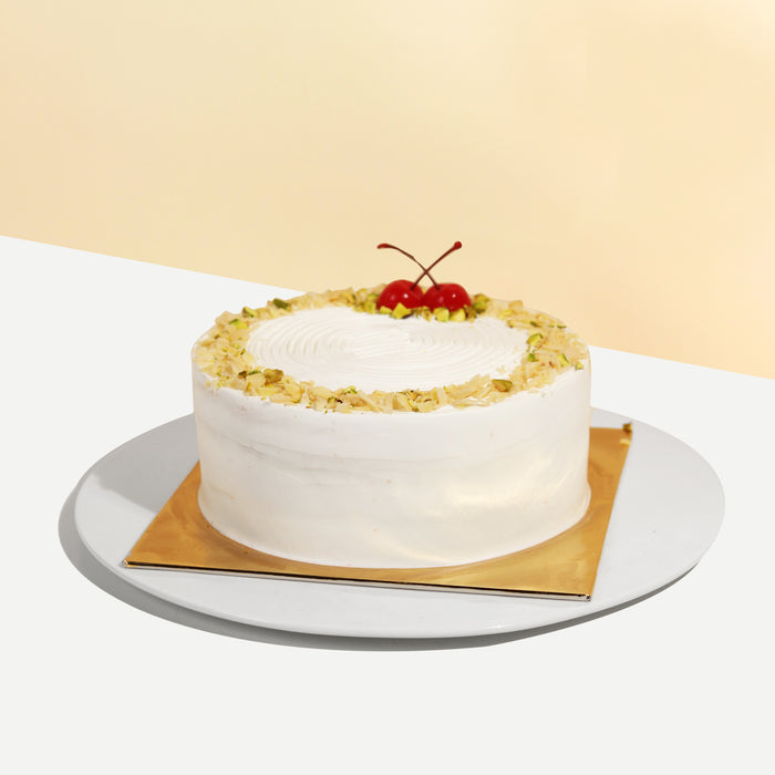 Vanilla sponge cake with Musang King durian flesh with almond flakes and pistachio