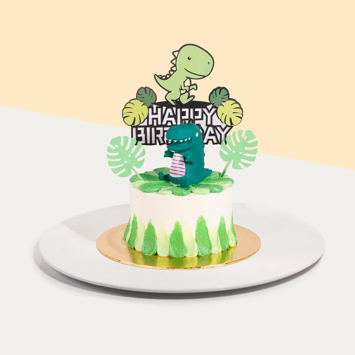Dinosaur themed butter cake, with green and white decorations