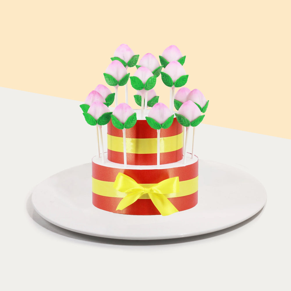 Cake pops decorated to look like longevity peaches