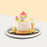 Longevity peach cake with fondant peaches on top