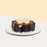 Tiramisu cake with chocolate shards, and heart shaped white chocolate on top