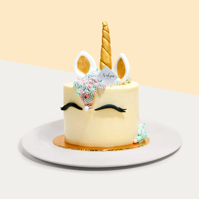 Unicorn themed cake , with blue and pink buttercream decorations