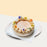 Cheesecake with walnuts and maple sauce, topped with Gula Melaka frosting