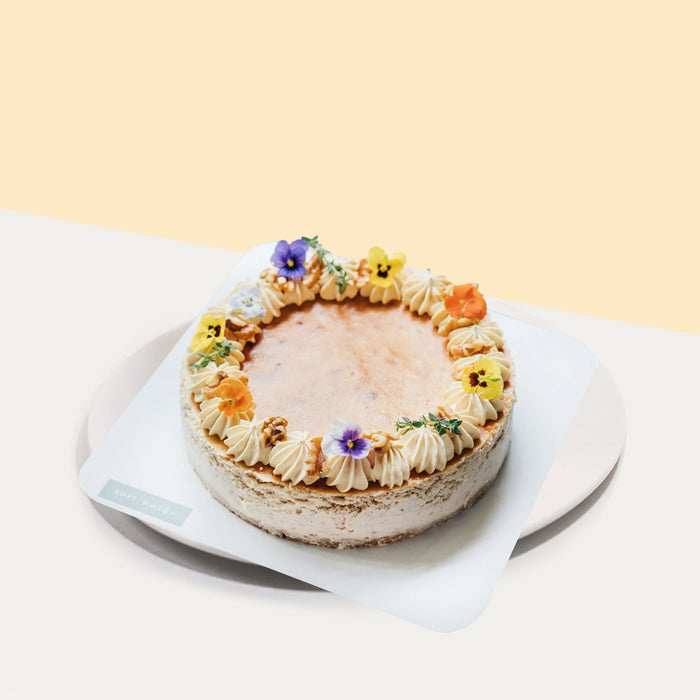 Cheesecake with walnuts and maple sauce, topped with Gula Melaka frosting