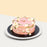 Korean inspired pink buttercream cake with hand piped daisy petals