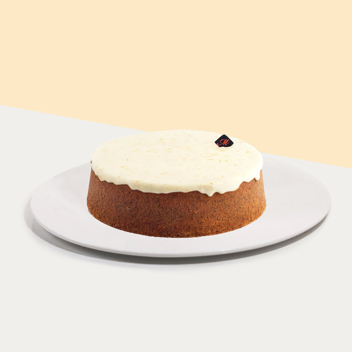 Butter cake with orange zest and poppyseed, topped with orange juice icing