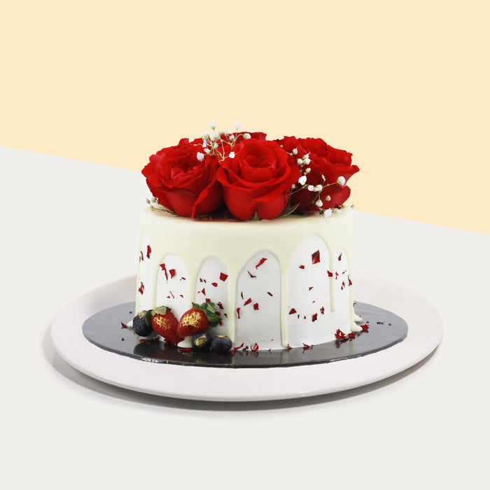 Cake designed for her, with white chocolate glaze, strawberries, blueberries and faux roses