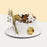 Rustic cake with dried foliage, flowers, cotton, and burnt lemon slices decorations