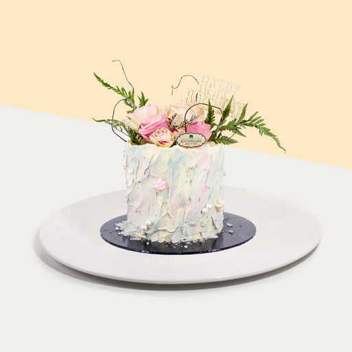 Hand-painted pastel buttercream topped with fresh flowers